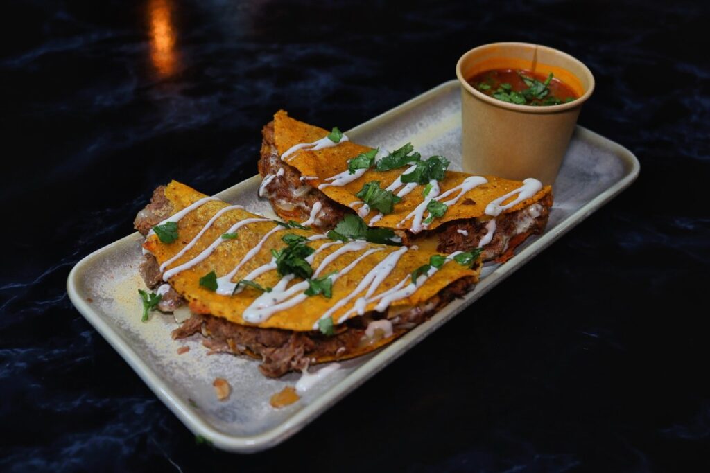 our best sellers, birria tacos 🌮 with saucy consume, birria sliders, soft and juicy, lastly the